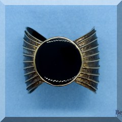 J36. Goldtone and onyx cuff bracelet - $38